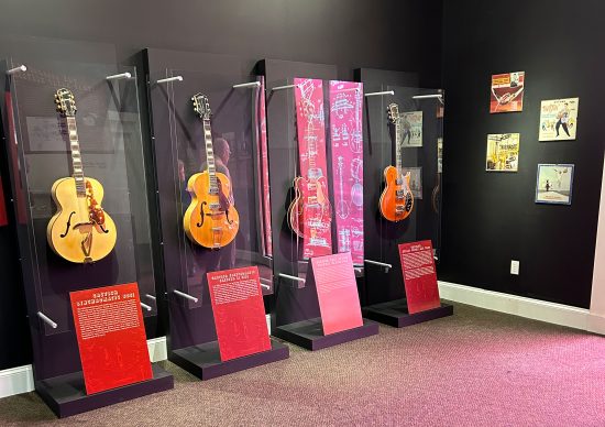 Four Gretsch guitars on display.