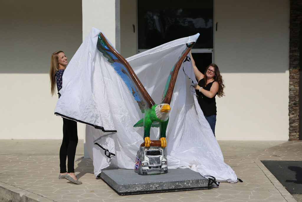 New Eagle Nation on Parade sculpture depicts 118-year history of the Howard family’s lumber business