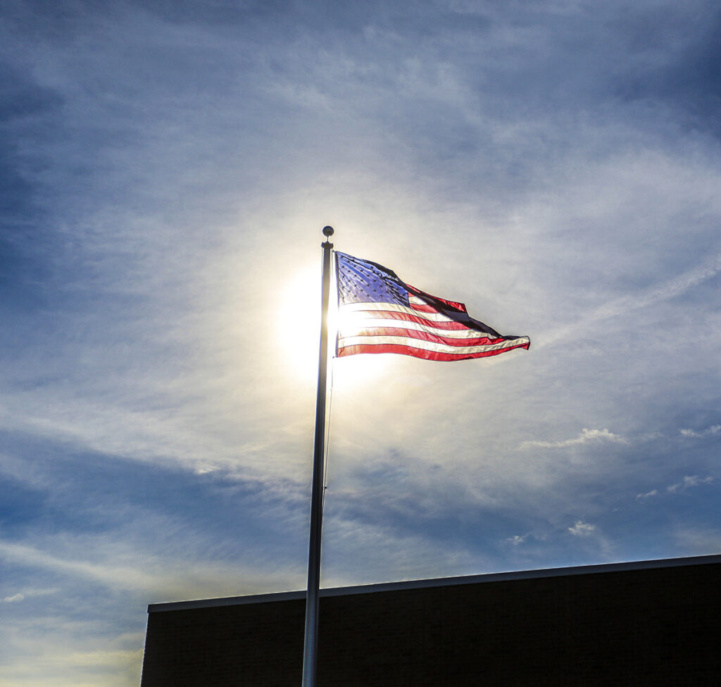 Georgia Southern University military veterans volunteer to maintain American flags on Statesboro Campus housing facilities