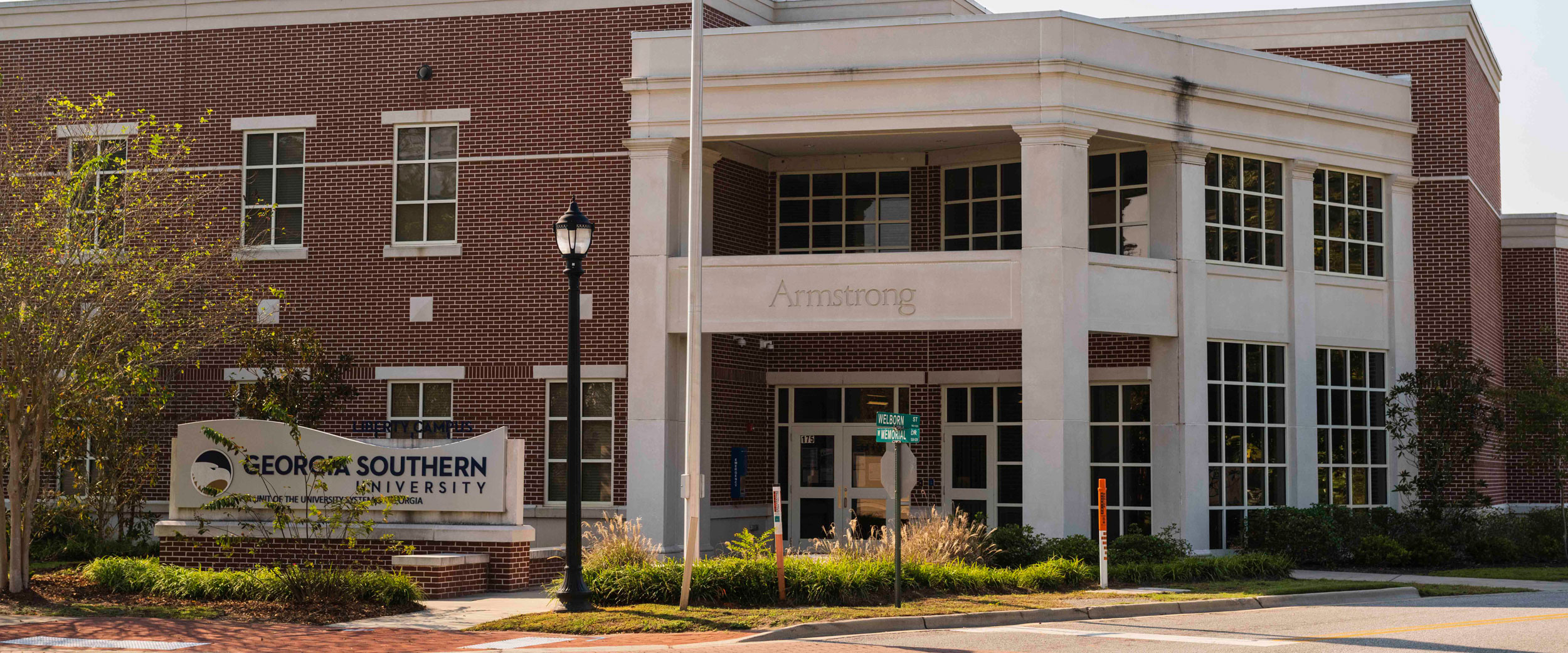 Exterior view of Georgia Southern University’s Armstrong campus building with university signage and landscaping.