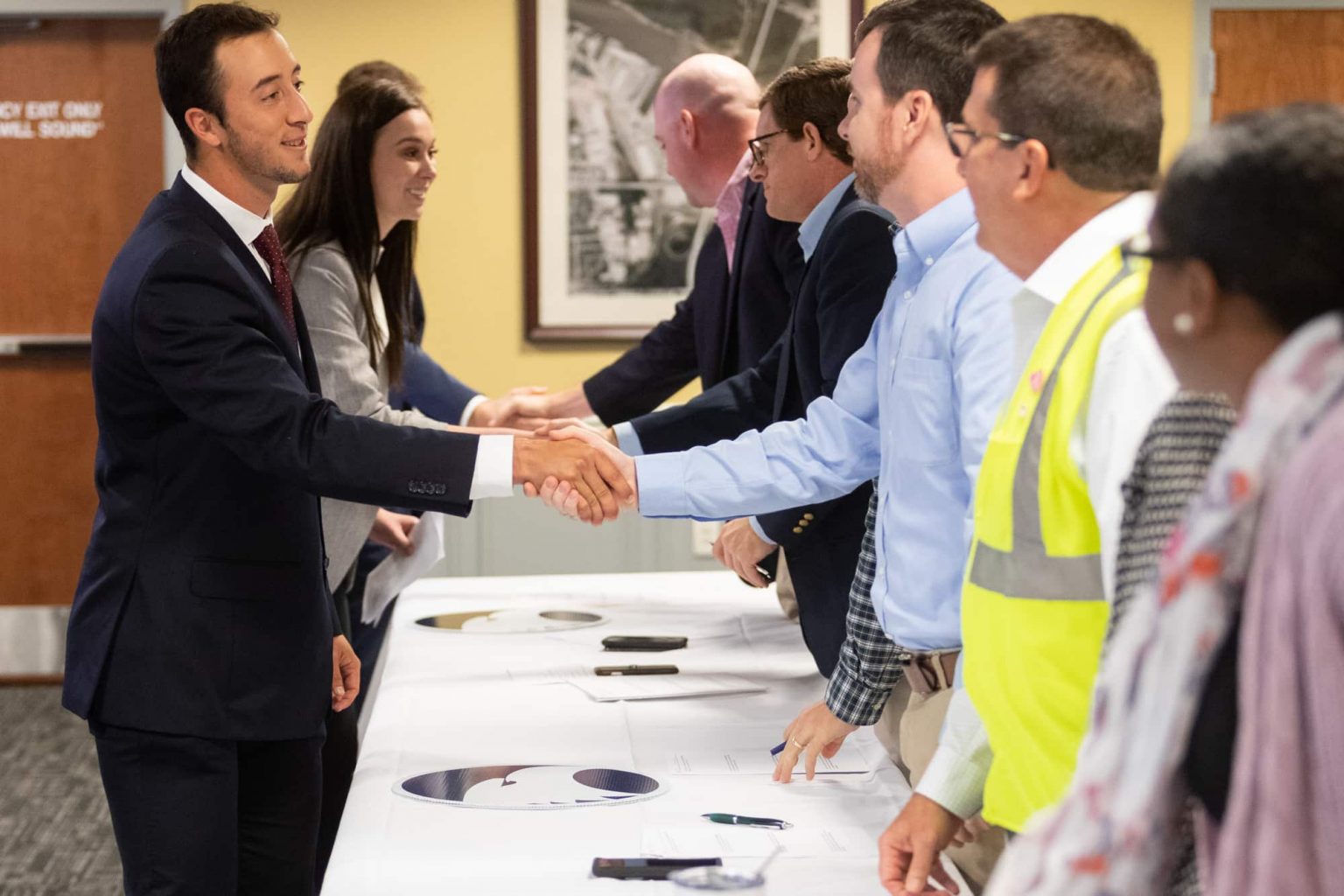 Georgia Southern College of Business faculty and students networking and engaging during a professional event.
