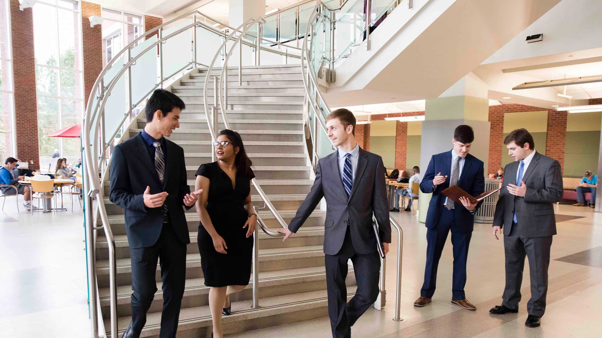 A group of Georgia Southern students discuss their recent informations systems and analytics pitch as successful young professionals.