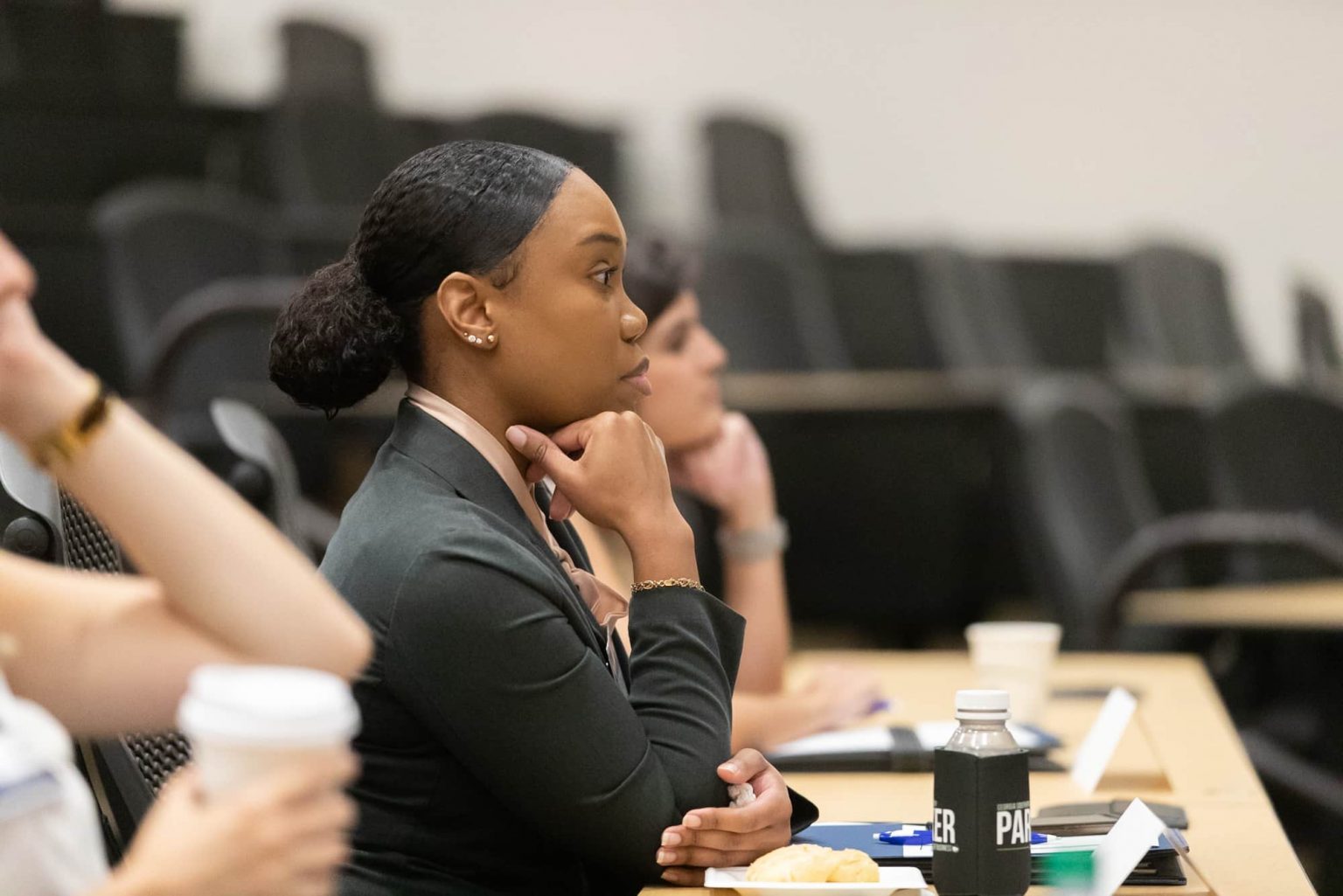 Georgia Southern finance student attentively listening during a lecture in a classroom setting.