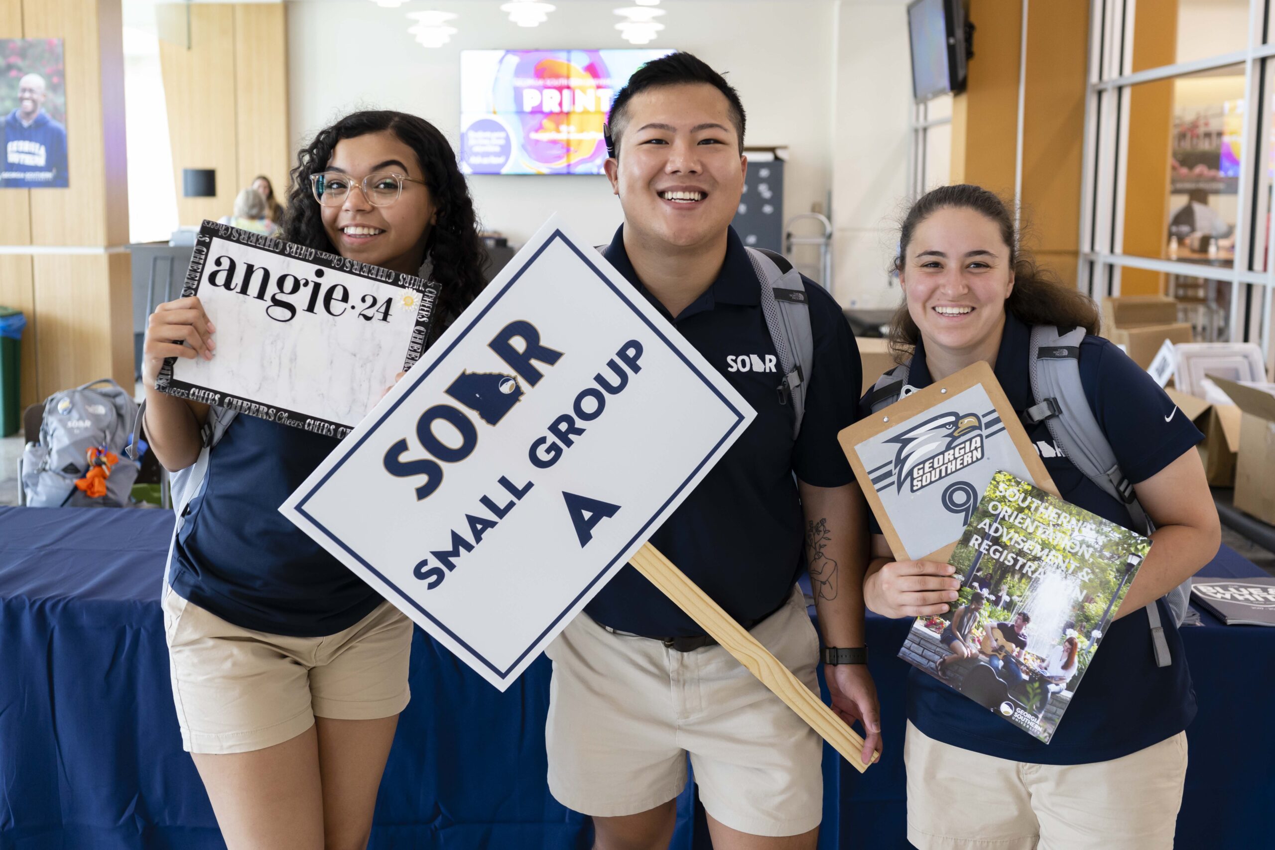 A group of Georgia Southern freshman collect welcome packets and information to start their college experience connected and informed.