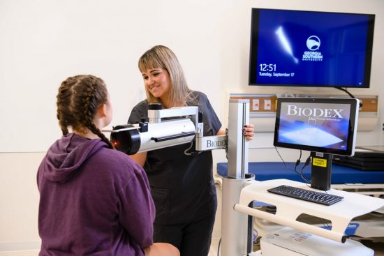 Georgia Southern clinical sciences students using a Biodex machine