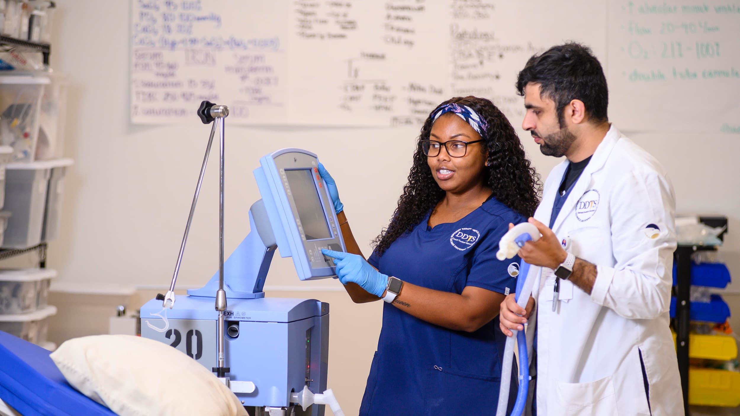 Georgia Southern Clinical Sciences students learning how to use a machine