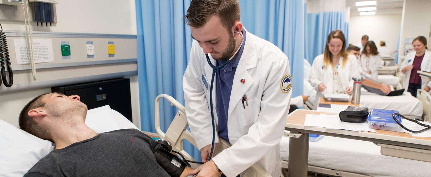 A student in Georgia Southern's Nursing, RN to BSN Program takes blood pressure to practice basic triage skills.