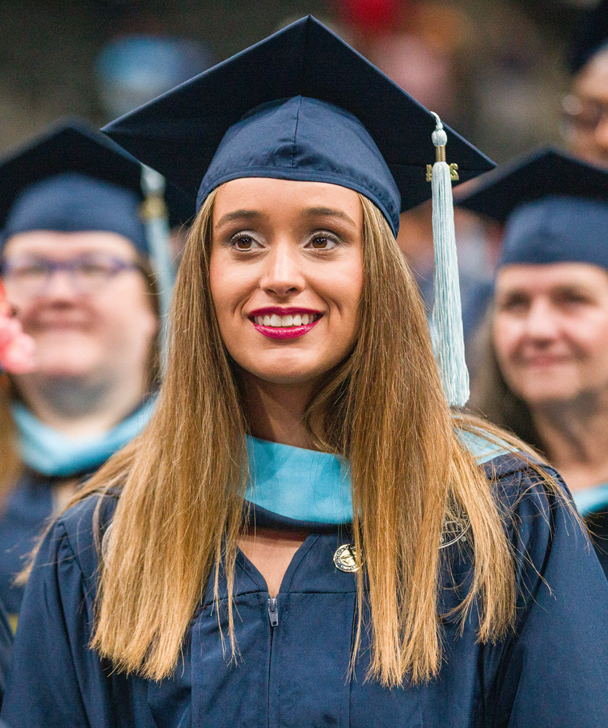 A Georgia Southern College of Education student in a cap and gown during commencement