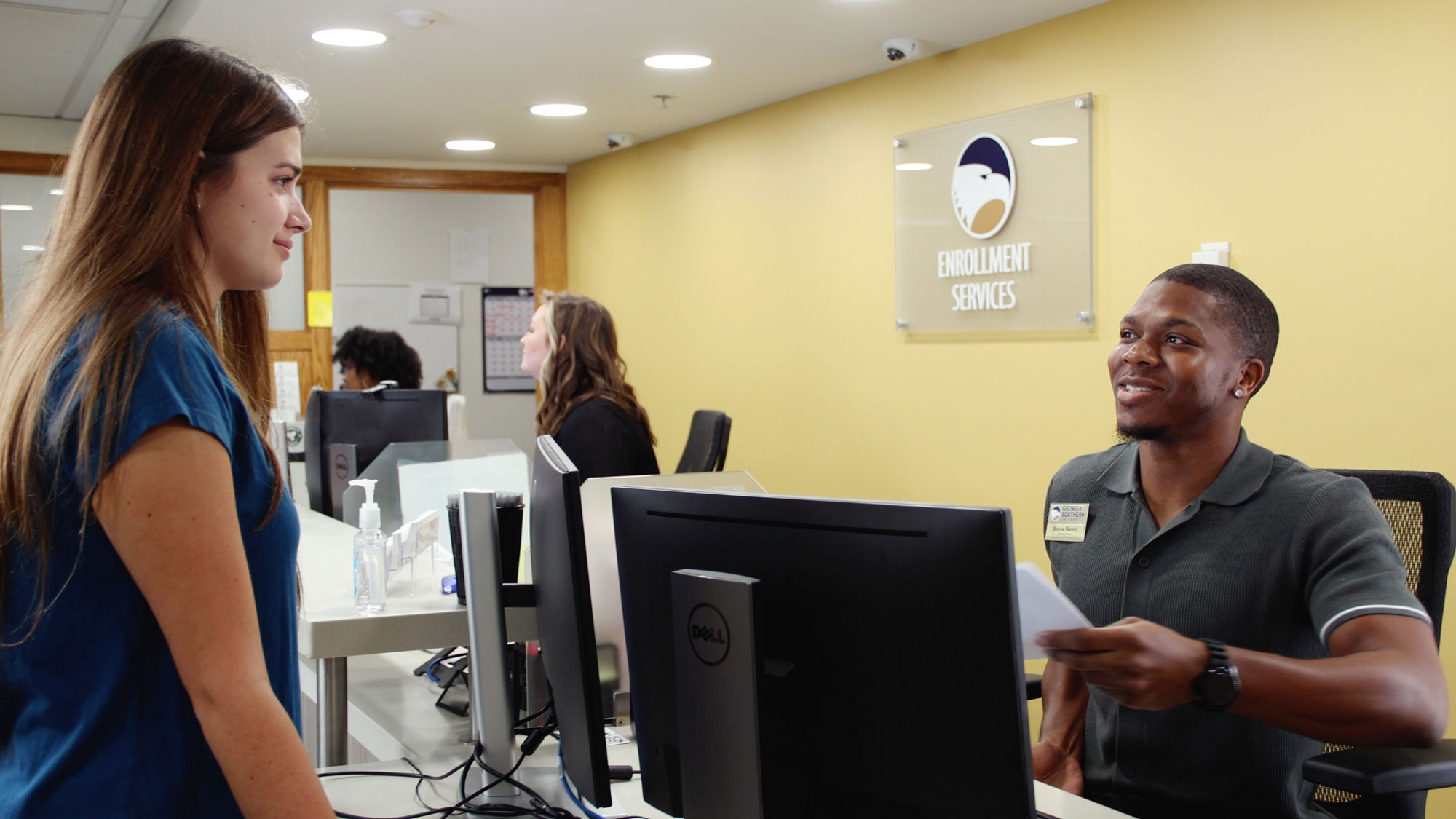 A Georgia Southern students submits paperwork for dual enrollment.