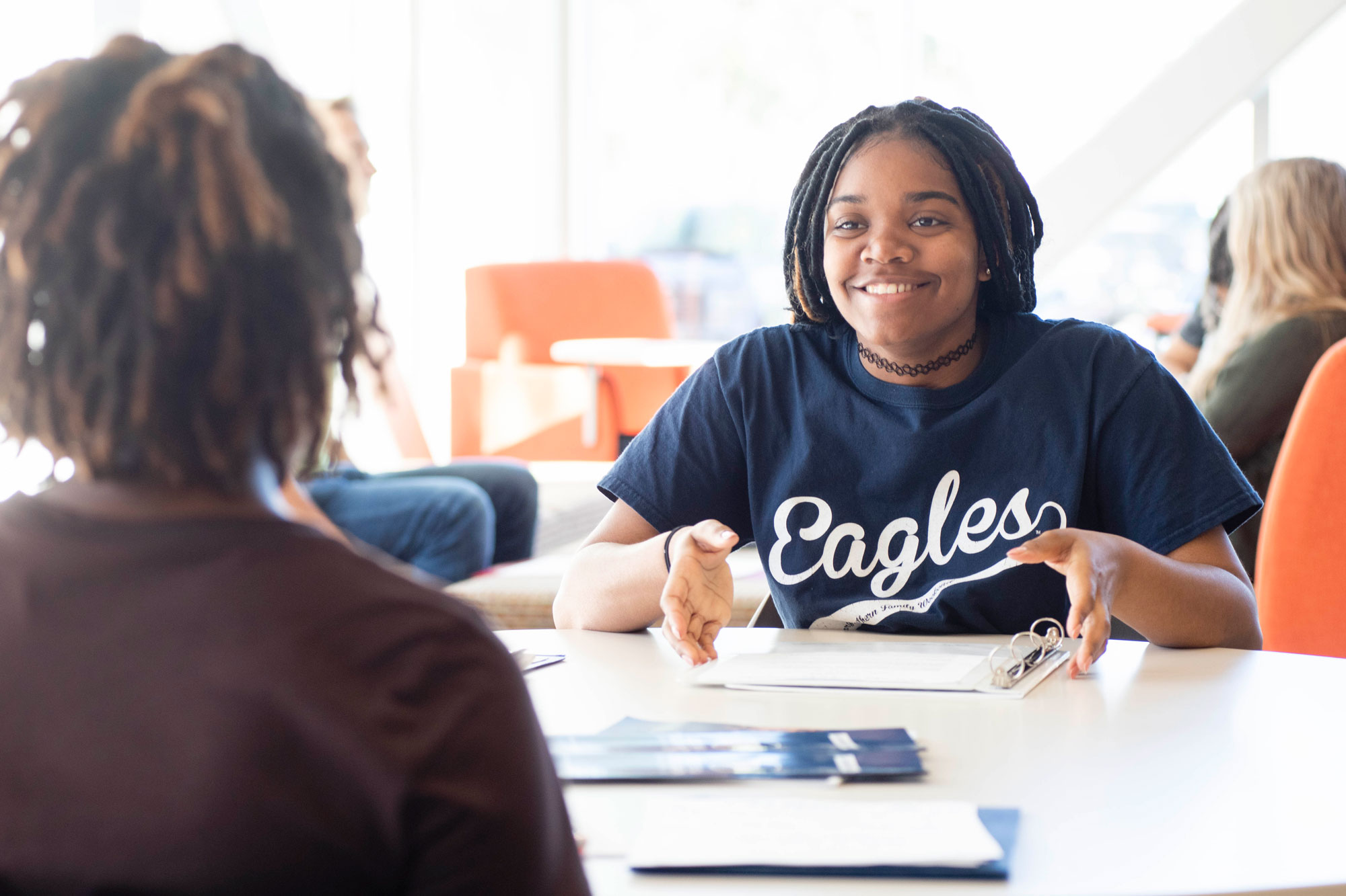 A first-year Georgia Southern freshman meeting new people in a community space.