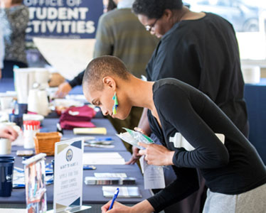Students from Georgia Southern's Accelerated BSN program browse student clubs and organizations at an activities fair.