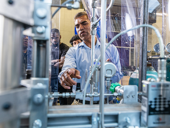 An adult learner at Georgia Southern experiences career training in machinery.