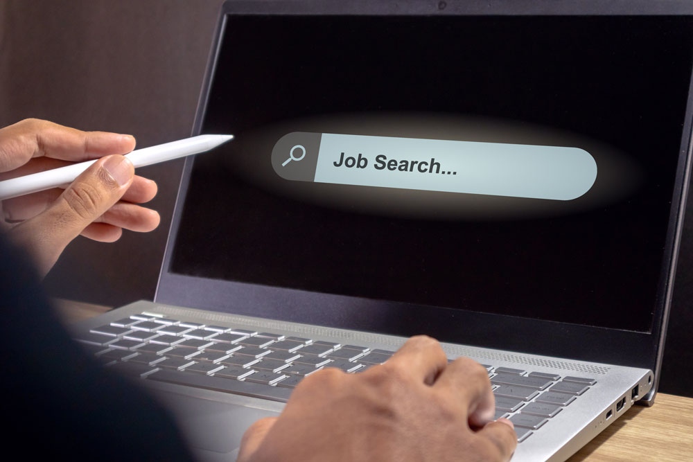 Laptop with job search.