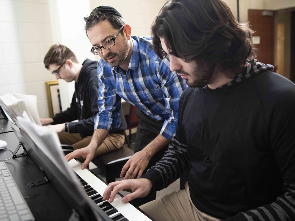 Georgia Southern students work with technology and keyboard piano to compose music in the Music Composition program.
