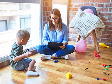 A Georgia Southern student observes a child for Behavior Analysis Minor.