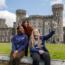 Georgia Southern study abroad students gather for a group selfie in front of a castle near Wexford, Ireland.