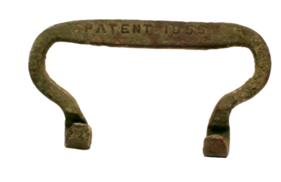 A brass buckle with the words patent 1855 stamped into it.