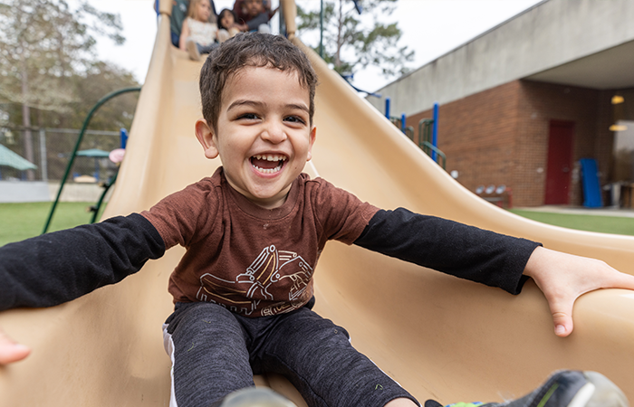 A child sliding down a slide