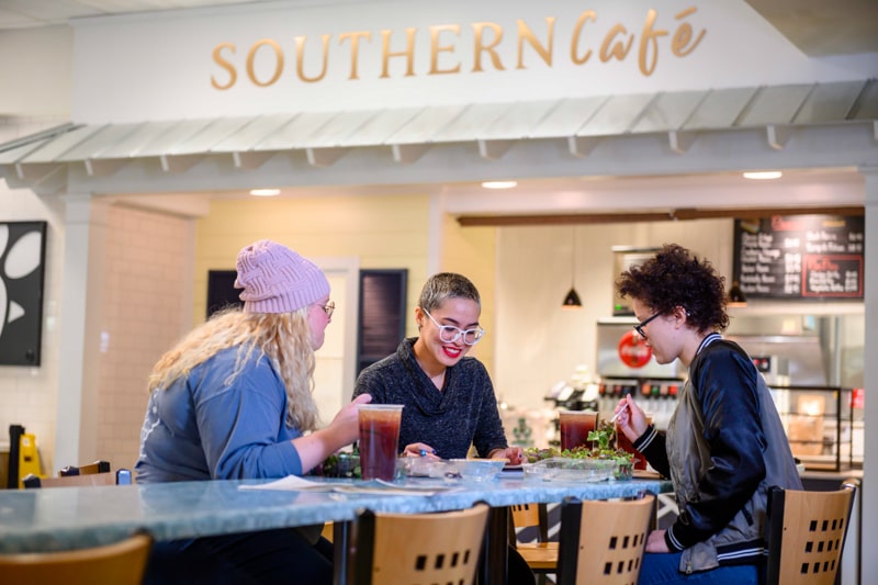 Three women enjoying lunch at a cafe