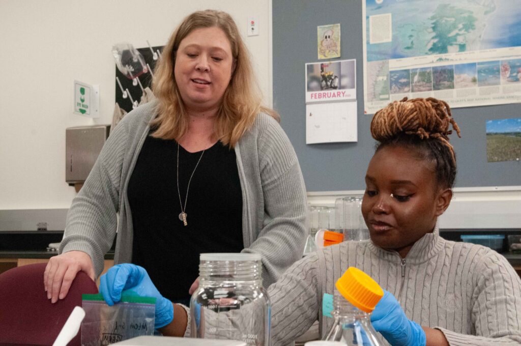 Biology professor Heather Joesting advises her student research assistant.