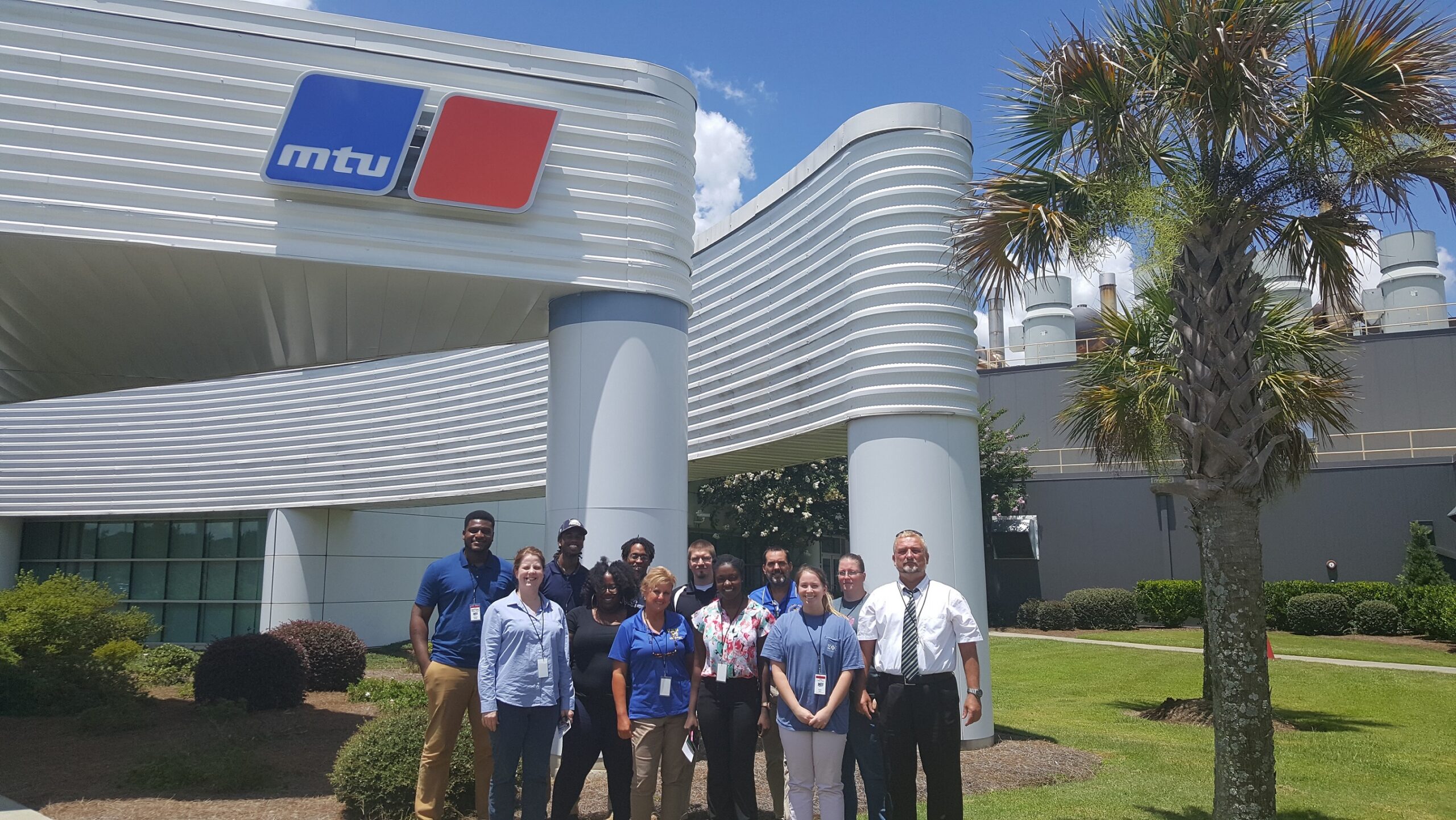 ENERGY participants gathering in front of a facility