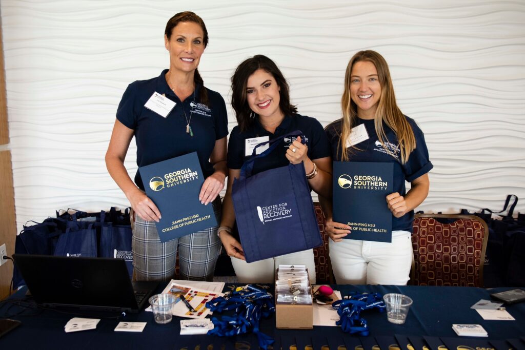 students posing for a picture at an event put on by the Center for Addiction Recovery