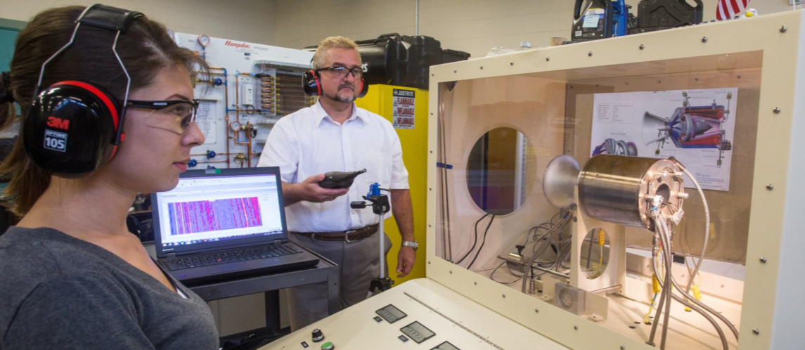 SAFRL students and faculty at work using equipment