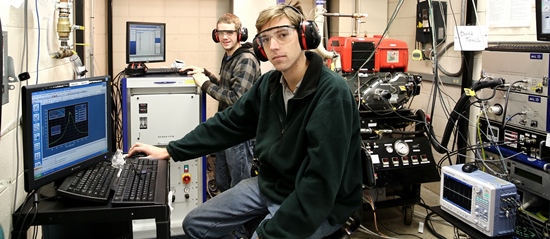 SAFRL students and faculty at work using equipment