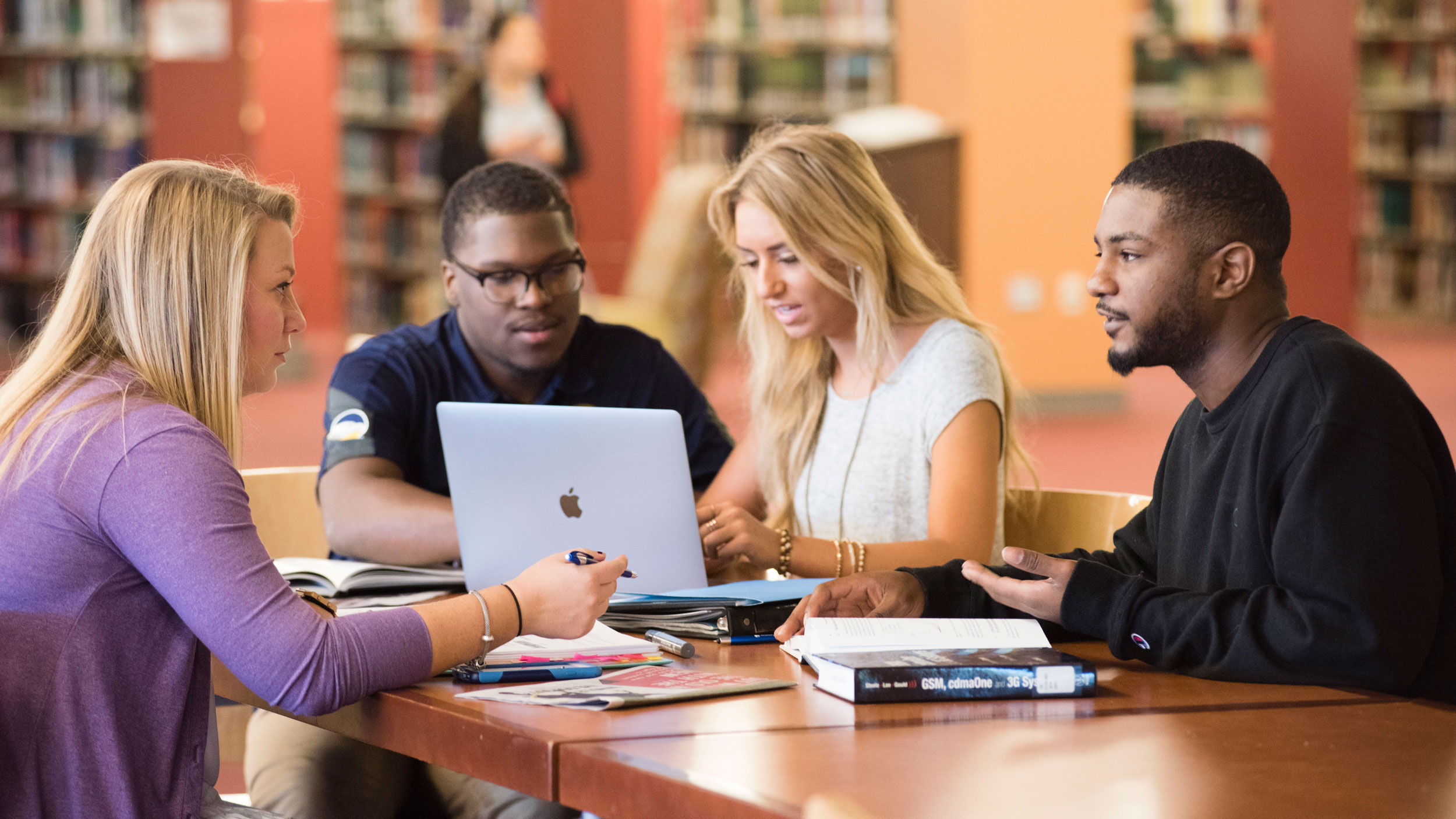 A group of Georgia Southern students studying in library.