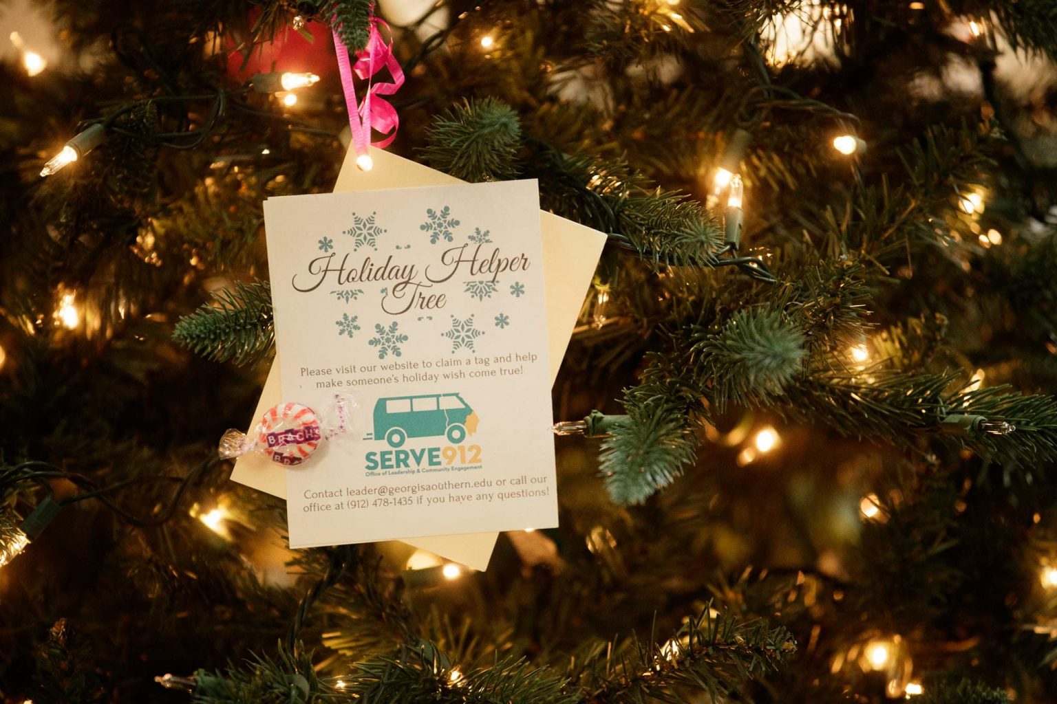 A tag on the holiday helper tree.