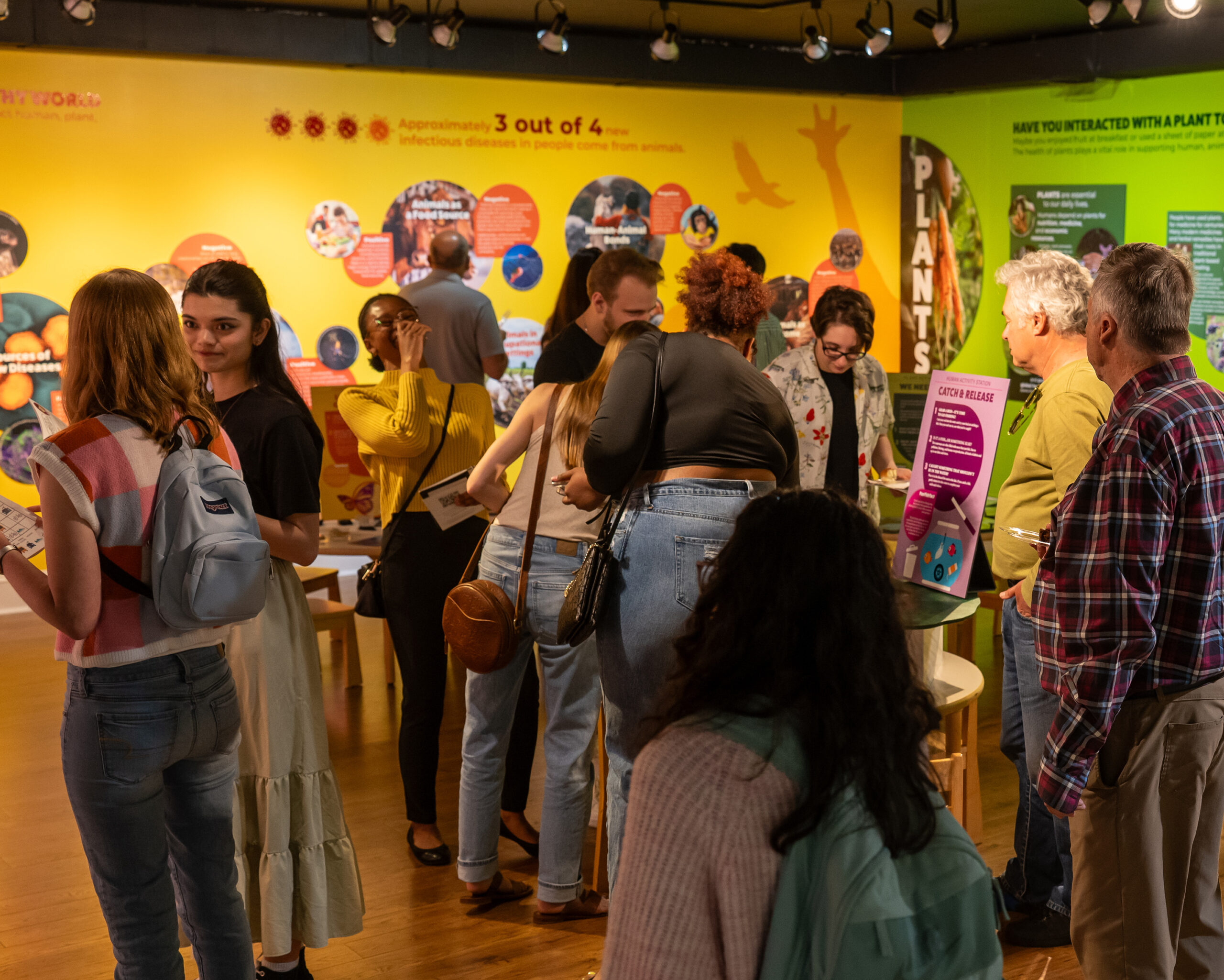 Visitors examine One Health exhibit
