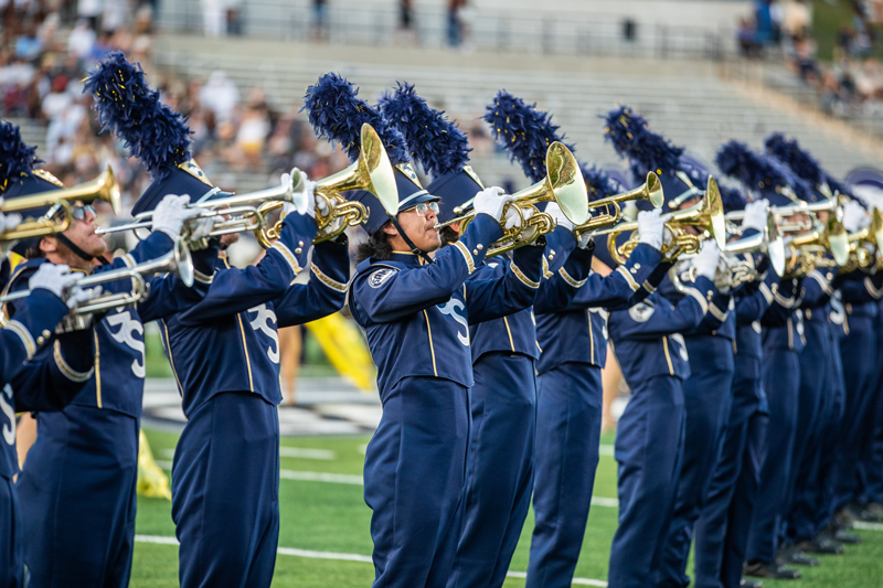 Georgia Southern marching band on the field at a football game.