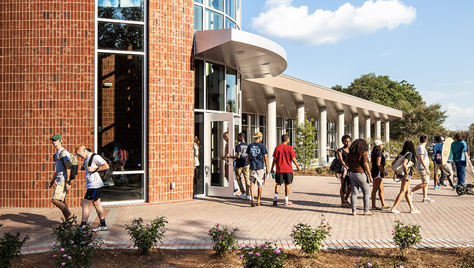Students walk through the plaza outside of the dining commons at the Statesboro Campus.