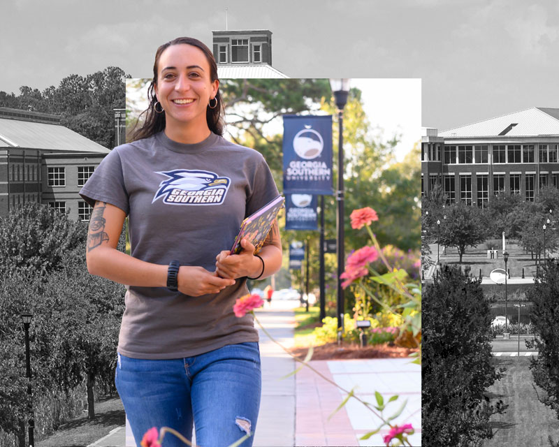 Young female Georgia Southern student walking on campus carrying books.