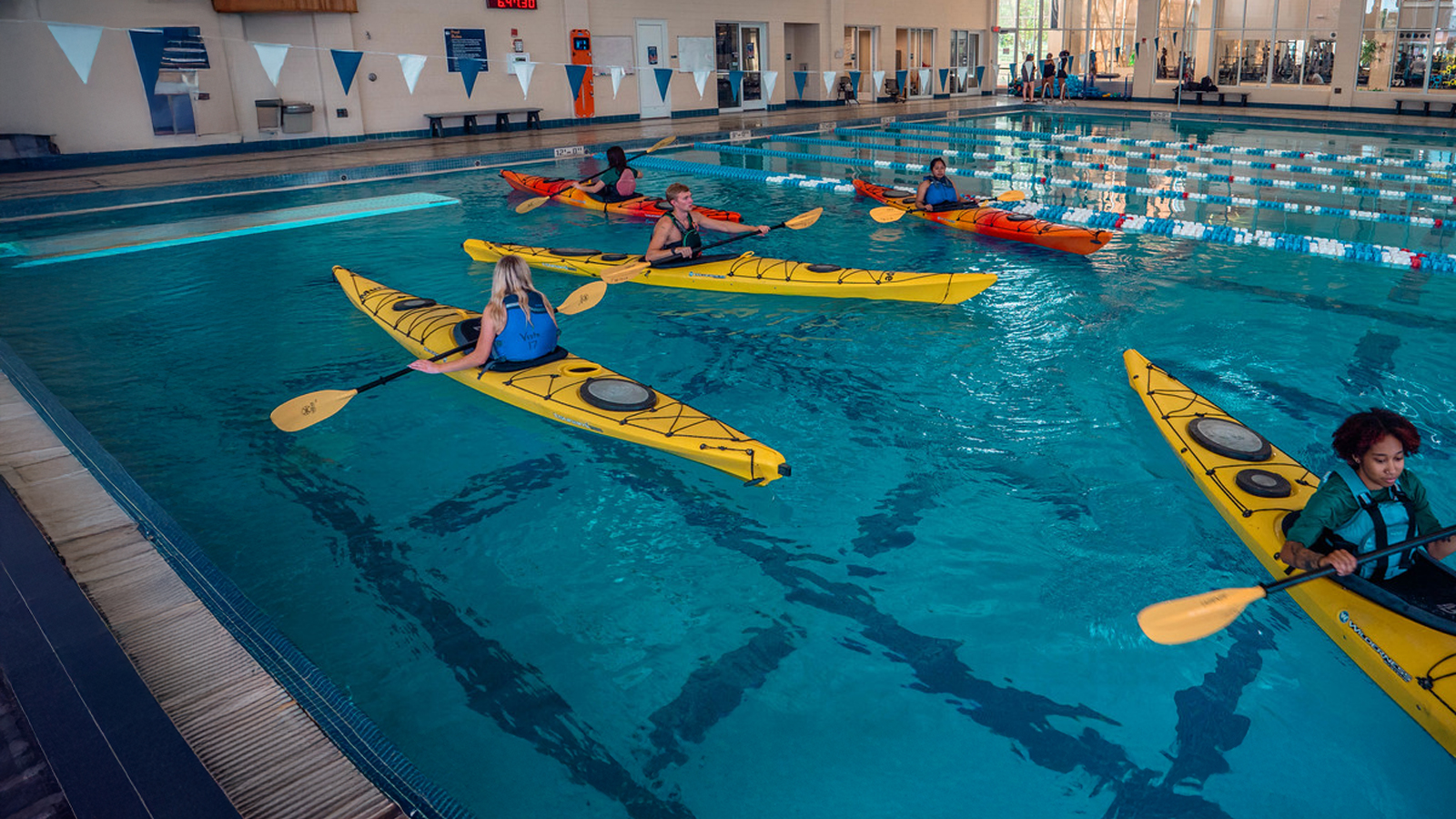 Georgia Southern students take kayak course and practice in the pool.