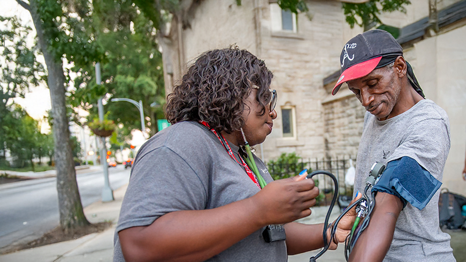 A Georgia Southern Student in the college of public health performs a blood pressure test on community member.