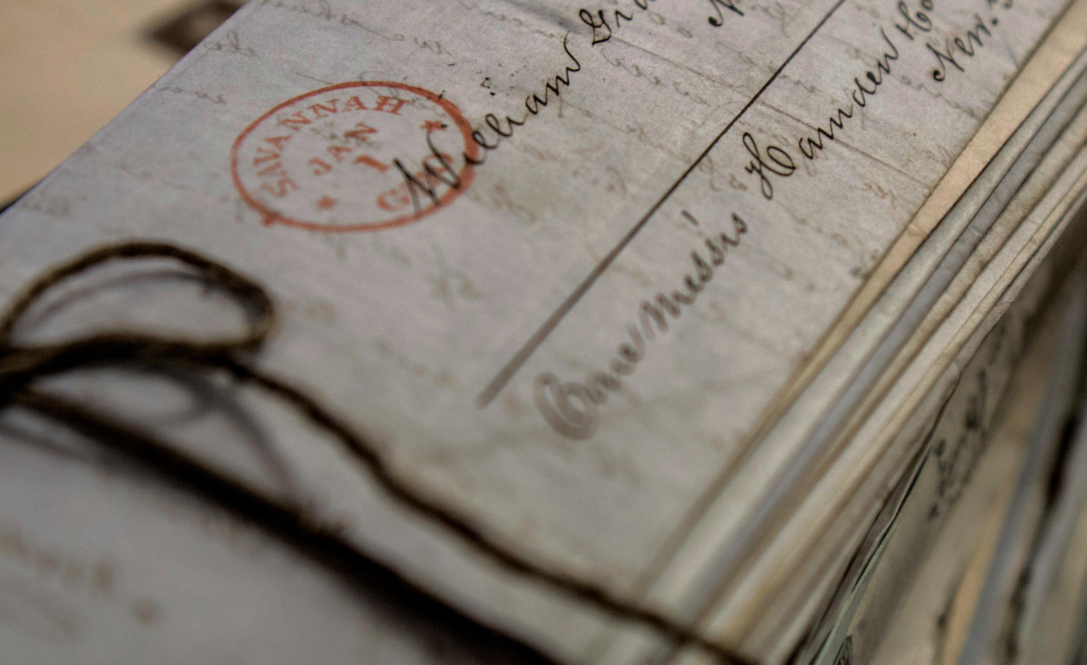 letters in a stack tied together with twine, addressed to Savannah Georgia