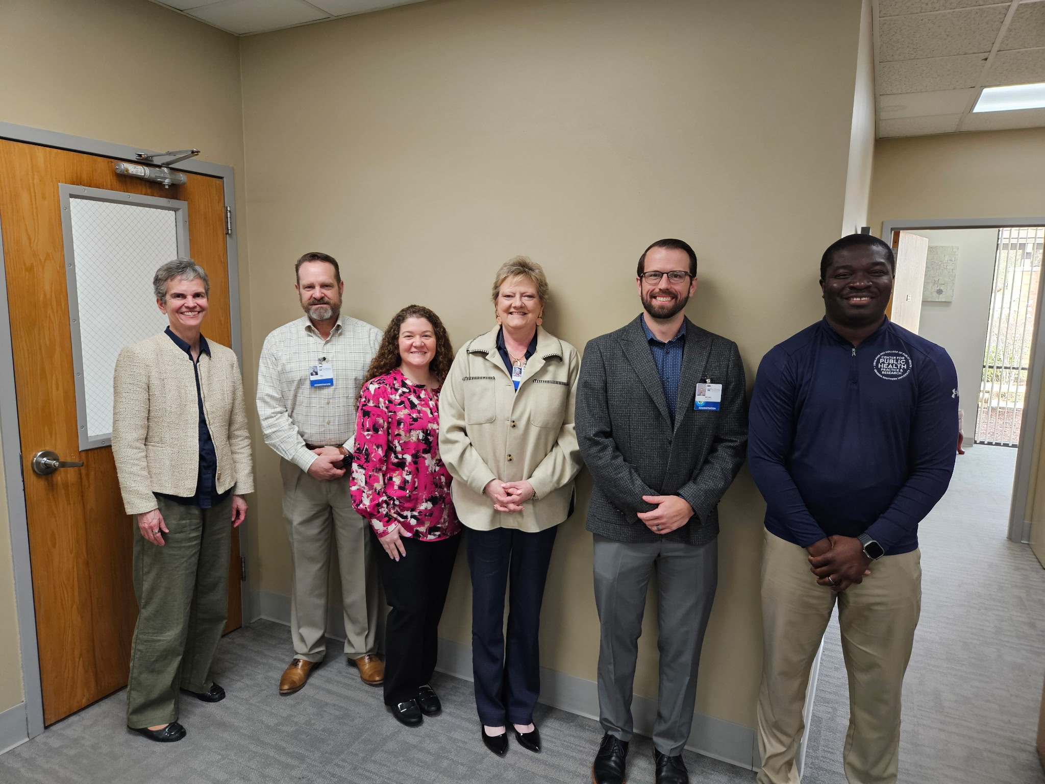 Six members of the public health practice team stand together