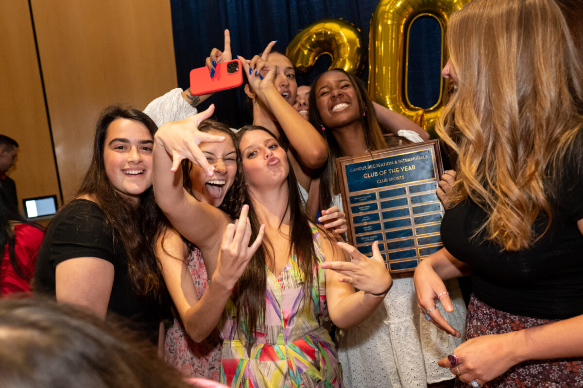 A group of Georgia Southern students celebrate their CRI Club sports award.