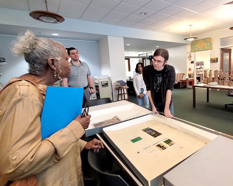 Deborah Johnson-Simon of the African Diaspora Museology Institute of Savannah, Ga. with undergraduate student Christian Cotten-Dixon as they review the Calvin and Virginia Jackson-Kiah papers donated by the organization to Georgia Southern.