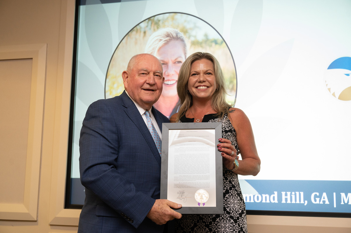 April Trepagnier with Sonny Perdue