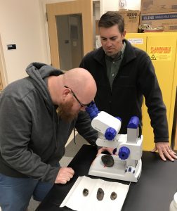 Professors Roberts and Cox looking at freshwater mussels