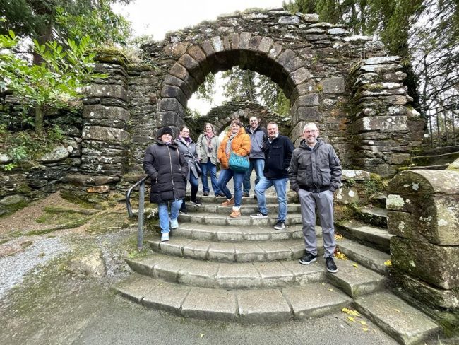 Betsy Barrow,Ed.D., left, Catherine Howerter, Ph.D., Amanda Wall, Ph.D., Alex Reyes, Ph.D., Dan Calhoun, Ph.D., Kip Sorgen, Ph.D., and Howard Keeley, Ph.D., at the Glendalough monastic site in Irealnd.