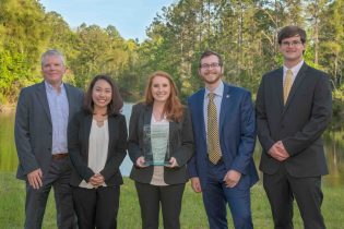 Jerry Burke (left), Ph.D., chair of the department of logistics and supply chain management, with the team who won the 2018 IANA UNF case competition.