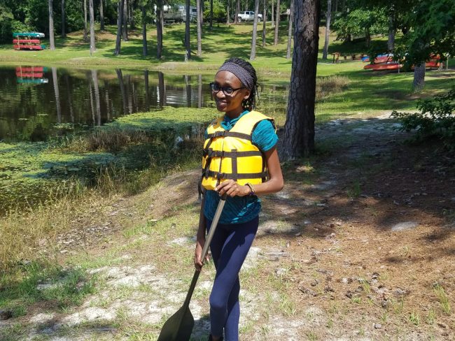 Tolulope “Tolu” Ojo, a biology graduate student at Georgia Southern University, poses for a photo at a camp she volunteers at. Tolu is hoping to get back to volunteering at the camp after the COVID-19 pandemic.