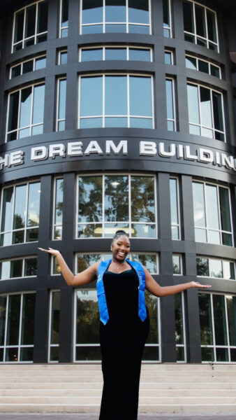 Laila Ward poses in front of the Dream Building at the Tyler Perry Studios Atlanta campus.