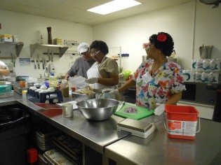 Martha Fannin of Columbus, Georgia and Shirley Jefferson of Augusta, Georgia listen to instructions from Michael Diangelo, executive chef at Forest Heights Country Club, on how to prepare healthier school meals. School nutrition managers from across the state of Georgia gathered at Georgia Southern University to attend Culinary Institute II, a 32-hour, weeklong training session by the Georgia Department of Education’s School Nutrition Program. The training session includes instruction and hands-on experiences.