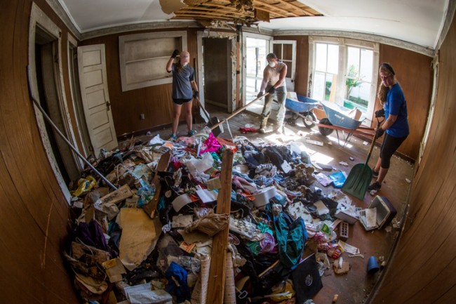 Students cleaning out abandoned house
