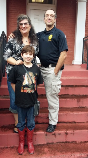 Dawn Garrigus (front) with her mom Kristy (left) and dad, Danny (right).