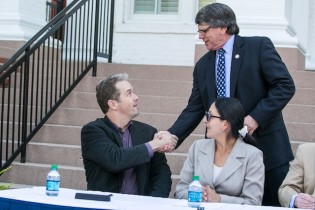 Mindo Coudforest Foundation (MCF) President Brian Krohnke shakes hands with Acting Vice President of Research and Economic Development Dr. Don McLemore, after signing a memorandum of understanding to officially establish Georgia Southern University's first permanent research station in Latin America. The new partnership will provide opportunities for faculty, undergraduates and graduates to conduct innovative and groundbreaking research on sustainable livelihoods and development, transnational connections, reforestation, climate change and more.